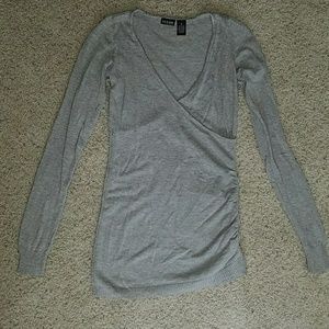 Tall grey silver sweater top. deep v